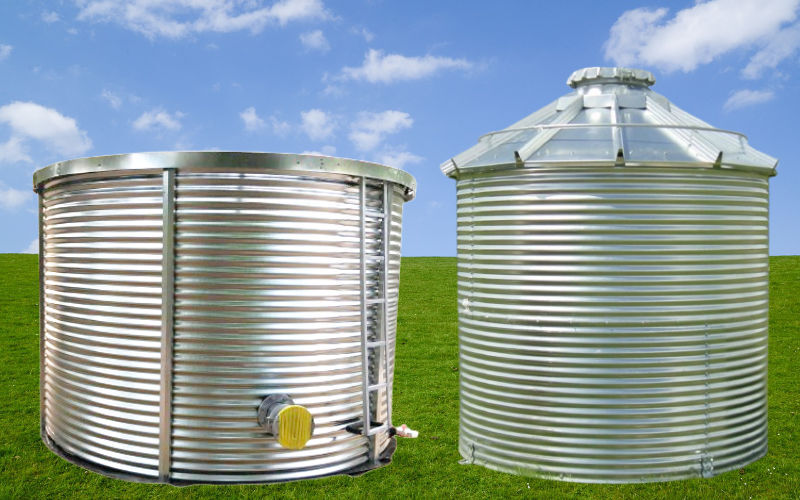 a large corrugated steel tank with plumbing around it
