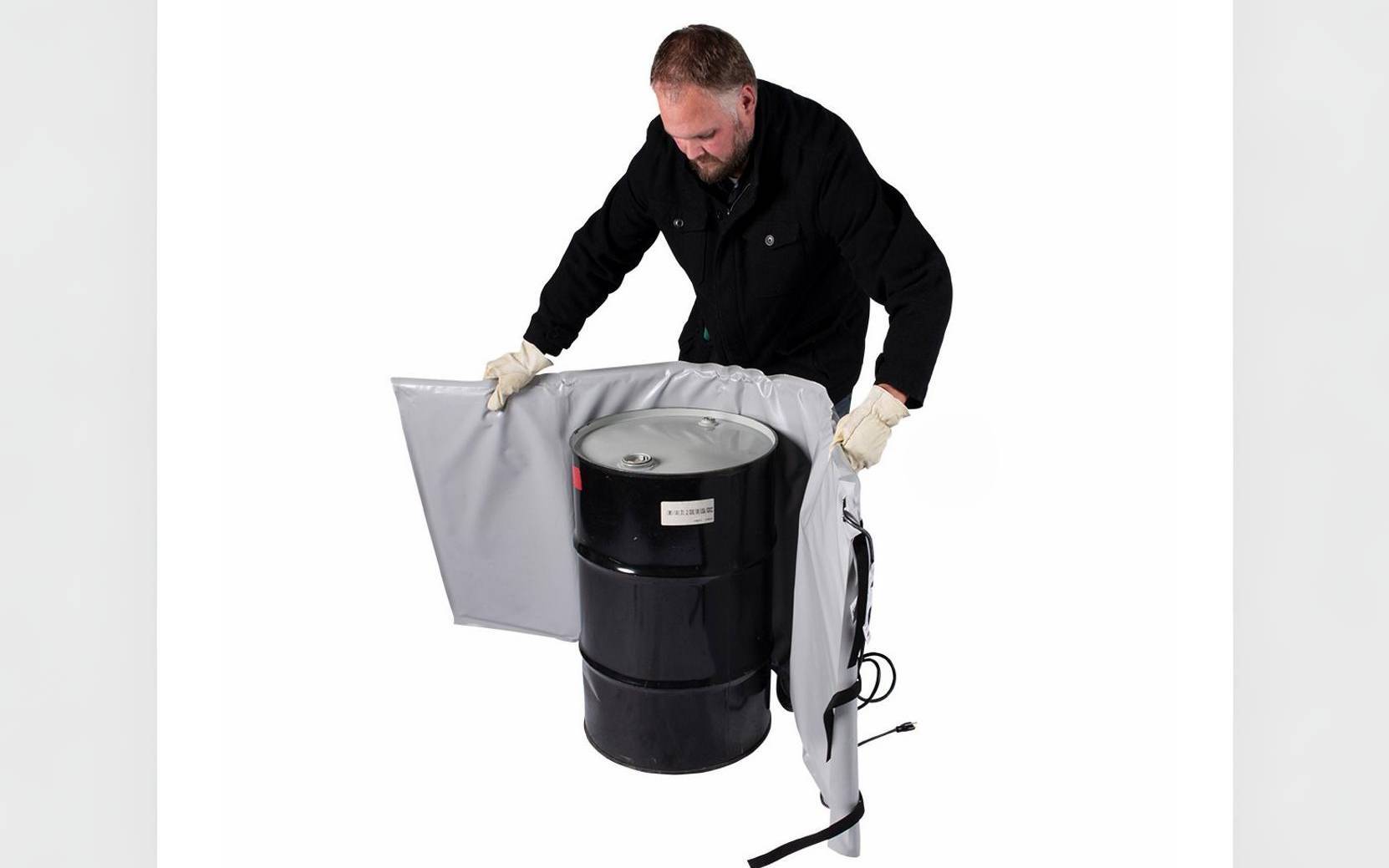 Man wrapping a tank heating blanket around drum/barrel.