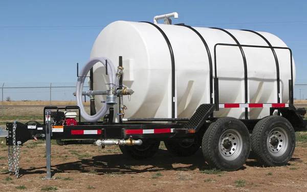 Side view of a 1025-gallon water trailer featuring a hose reel, pump, and spray system for various water transport tasks