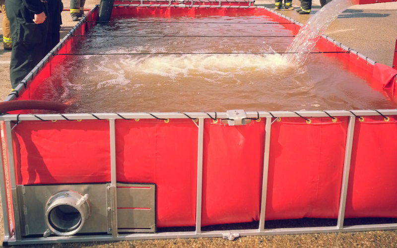 a red frame tank filled with water