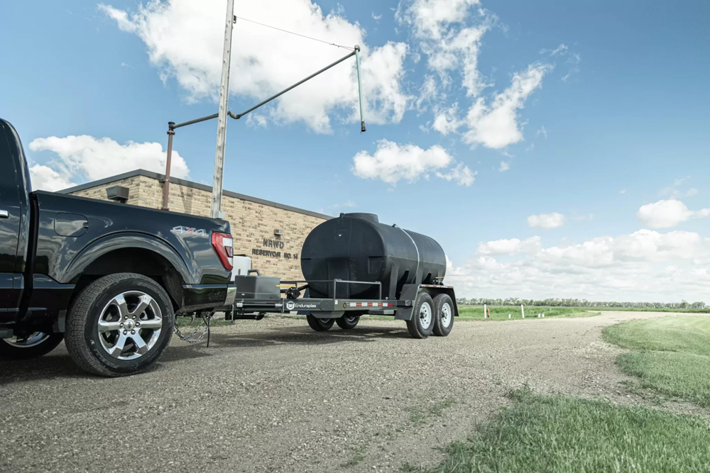 truck towing a water trailer