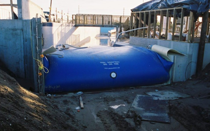 Flexible tank used for temporary water storage during pool repair.