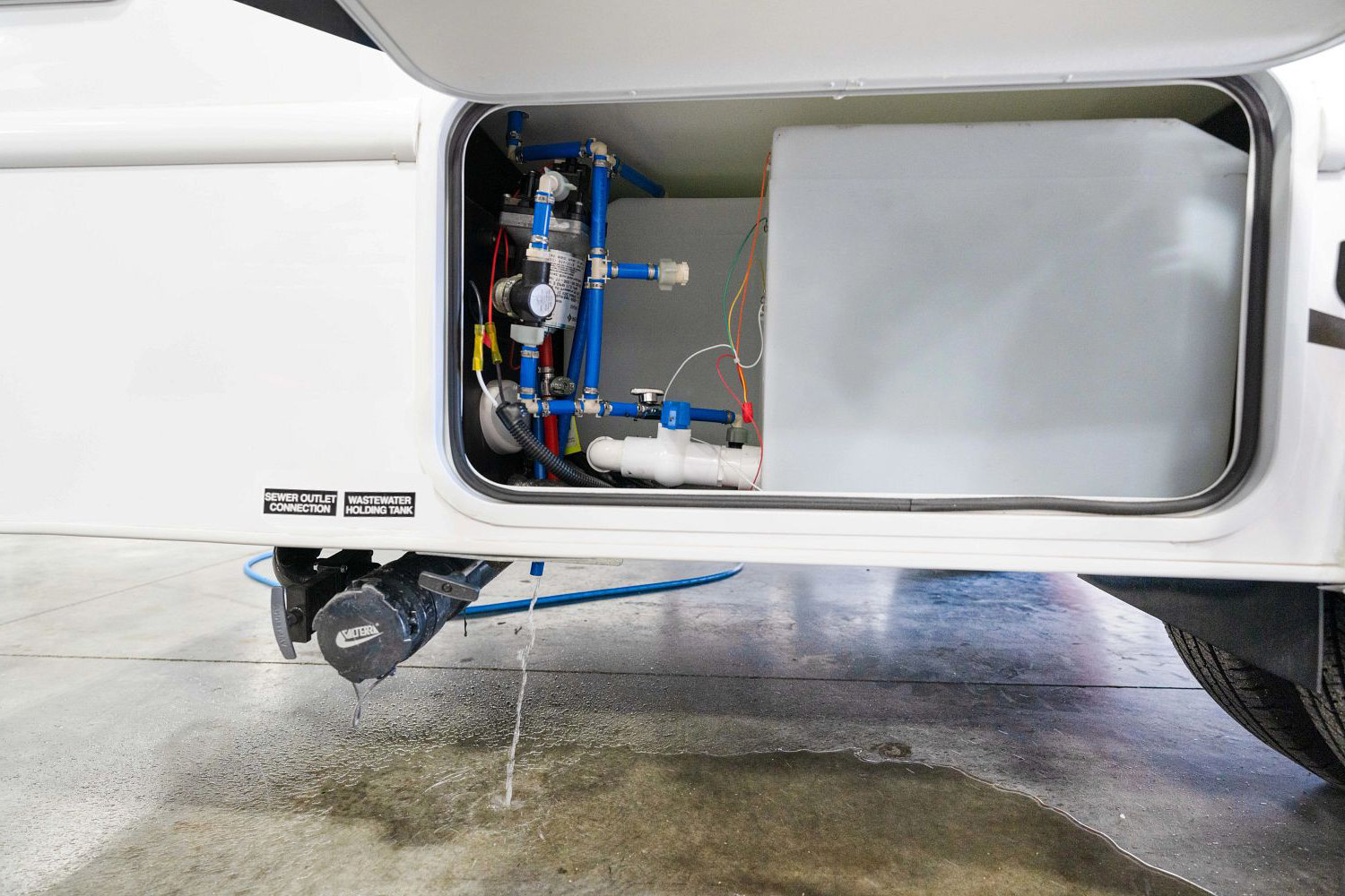 RV freshwater tank installed in an undercarriage compartment, designed for efficient potable water storage and use during travel.
