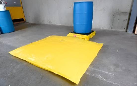 yellow bladder system place infront of drum