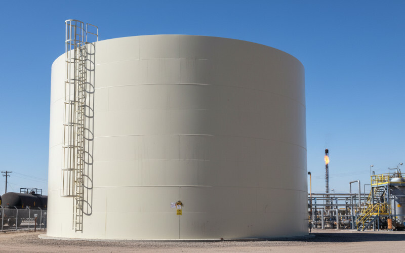 a job site with corrugated tank installation in process
