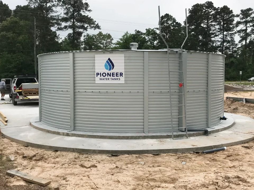 Corrugated steel water tank installed on a concrete pad
