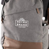 Custom embroidered cotton canvas backpack with laptop sleeve, side pocket, and faux leather details