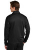 model wearing back of Sport-Tek® Travel Full-Zip Jacket in black