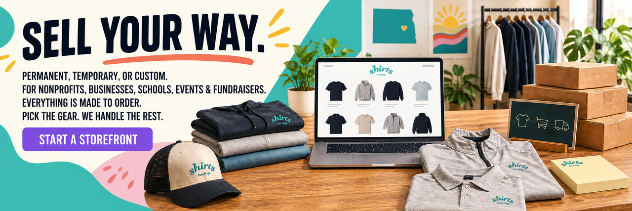 Shirts From Fargo “Sell Your Way” banner featuring colorful brand accents, folded apparel, a branded cap, an online storefront displayed on a laptop, shipping boxes, and a “Start a Storefront” button.