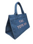 ClaraNY Denim book tote indigo denim spacious and charming  with "The Tote Bag"  letteringlder strap