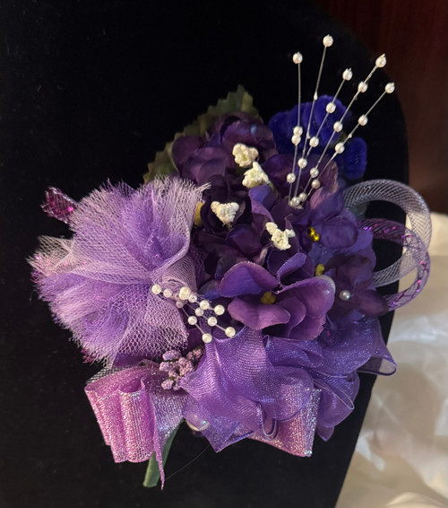 African violet corsage for Deltas - DESIGNS WILL VARY - ALANA - African violets - ribbon and pearls - African violet corsage - Purple ribbon - Floral clusters on an medium-length leaf - Delta Sigma Theta African Violet Corsage African violet corsage for Deltas - DESIGNS WILL VARY - ALANA - African violets - ribbon and pearls - African violet corsage - Purple ribbon - Floral clusters on an medium-length leaf - Delta Sigma Theta African Violet Corsage