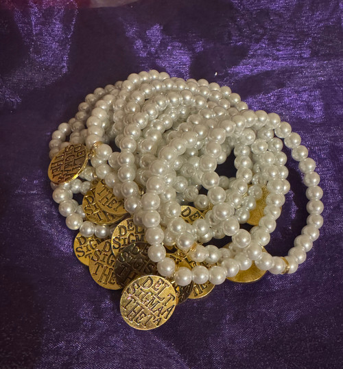 Ivory-Pearl Beaded - ONE BRACELET (1) Delta Text - Gold tone  Pendant - Bracelet - off-white Beaded Bracelet - Stretch Roll-on Bracelet - Delta Sigma Theta Text  Ivory-Pearl Beaded - ONE BRACELET (1) Delta Text - Gold tone  Pendant - Bracelet - off-white Beaded Bracelet - Stretch Roll-on Bracelet - Delta Sigma Theta Text
