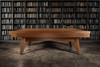 The Scholar Slate Pool Table is shown with its optional dining top installed, seamlessly transforming it from a luxury game table to a refined dining or meeting surface. The Pecan finish enhances the warm, inviting aesthetic, making this dual-purpose design ideal for multifunctional residential spaces or boutique hospitality venues. Crafted in the USA and tailored to your style.