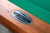 Close-up view of the Doc & Holliday logo plate on The Classic Slate Pool Table. The brushed steel branding plate is mounted into the rustic pine frame, serving as a mark of authenticity and American-made craftsmanship.