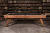 Side profile of the Marvin Muse Slate Pool Table from the photo shoot. Highlights include genuine leather drop pockets, mother-of-pearl diamond sights inlaid into the maple rails, and the steel Doc & Holliday Billiards logo plate stamped Made in USA. Built for both design presence and professional slate playability.
