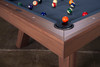 Detail close-up of the George Pool Table’s genuine leather drop pocket, Gray Walnut rail, and spill-proof Championship felt. The image highlights both the luxury materials and the precision construction that make this a high-end slate billiard table.