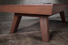 Close-up of the George’s outward-flared mid-century modern legs, finished in Gray Walnut. The angled stance emphasizes the table’s confident, design-forward character.