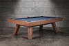 The Doc & Holliday George Slate Pool Table in Gray Walnut captured in a bold 3/4 angle, showcasing its mid-century modern flared legs and solid acacia wood construction. The sleek cabinet and exclusive finish give this slate billiard table a cinematic presence that commands attention in any luxury game room or commercial setting.