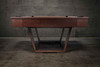 Wide, low-angle shot of the Zoey slate pool table, made in the USA; elongated rails, true 1″ slate surface, and sculpted U-legs anchor the room like luxury furniture built for real play.