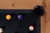 Overhead corner view of the Doc & Holliday Parsons Pool Table in Rustic White Oak. Focus on the top oak rails with custom inlaid billiard sight and black felt playing surface. Hand-weathered solid white oak construction, made in the USA luxury billiards table.