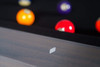 Detail shot of the Metalsmith’s genuine leather drop pocket and black metal rail sights, paired with smooth hardwood edges — a modern-industrial interpretation of luxury billiards craftsmanship.