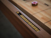 Close-up view of the embedded recessed scoring system on the Paula Parsons Shuffleboard Table by Doc & Holliday, highlighting the detailed craftsmanship and smooth maple butcher block playfield.