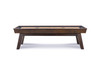 The George Shuffleboard Table by Doc & Holliday in antique coffee finish, shown from an angled perspective that highlights its modern proportions and warm wood tone. Designed with a professional maple playing surface and a grounded architectural stance, this 9-foot table brings balance, weight, and presence to refined game rooms.
