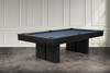Three-quarter lifestyle view of the Jackies slate pool table by Doc & Holliday in sleek black maple finish, with block pedestal legs, tapered rails, and leather drop pockets. Proudly made in the USA, this slate billiard table is designed for modern interiors.