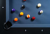 Up-close corner pocket of the Jackies slate pool table in black finish, showing genuine leather drop pocket, maple rail, Championship felt, and part of the Doc & Holliday Luxury Ball Set. A detail that highlights American craftsmanship.