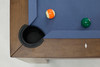 Overhead corner pocket view of the Peter Parsons Custom Billiards Table with Academy Blue felt, leather pocket, pearl diamond sight, and Van Dyk wood rail.