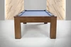 Straight-on photo shoot view of the Peter Parsons Custom Slate Pool Table in Van Dyk finish with Academy Blue felt, solid maple construction, and tailored modern legs.