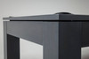 Close-up of the Peter Parsons rail and apron in Matte Smoke, showing solid maple construction, clean lines, and a sleek hand-finished profile.