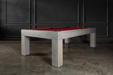 The Natural Slate Pool Table by Doc & Holliday in Grey Wash — three-quarter front view in a designer game room with Restoration Hardware-inspired décor, shown with bold red Championship felt.