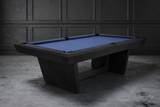 Kaci Slate Pool Table by Doc & Holliday in Black Ash finish styled in a modern loft with concrete floors and textured cement walls