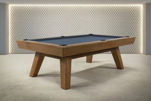 Angled view of the George Slate Pool Table emphasizing the bold, flared leg design, tapered geometry, and the natural grain character of the glazed maple finish.