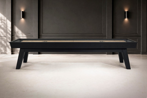 Side view of the George Shuffleboard Table in Black Ash by Doc & Holliday with tapered legs and maple playfield.
