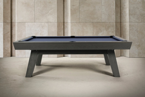 Angled side view of the George Marble Grey Ash Slate Pool Table showing the grey ash wood grain, clean rail profile, blue felt, and mid-century modern leg design.