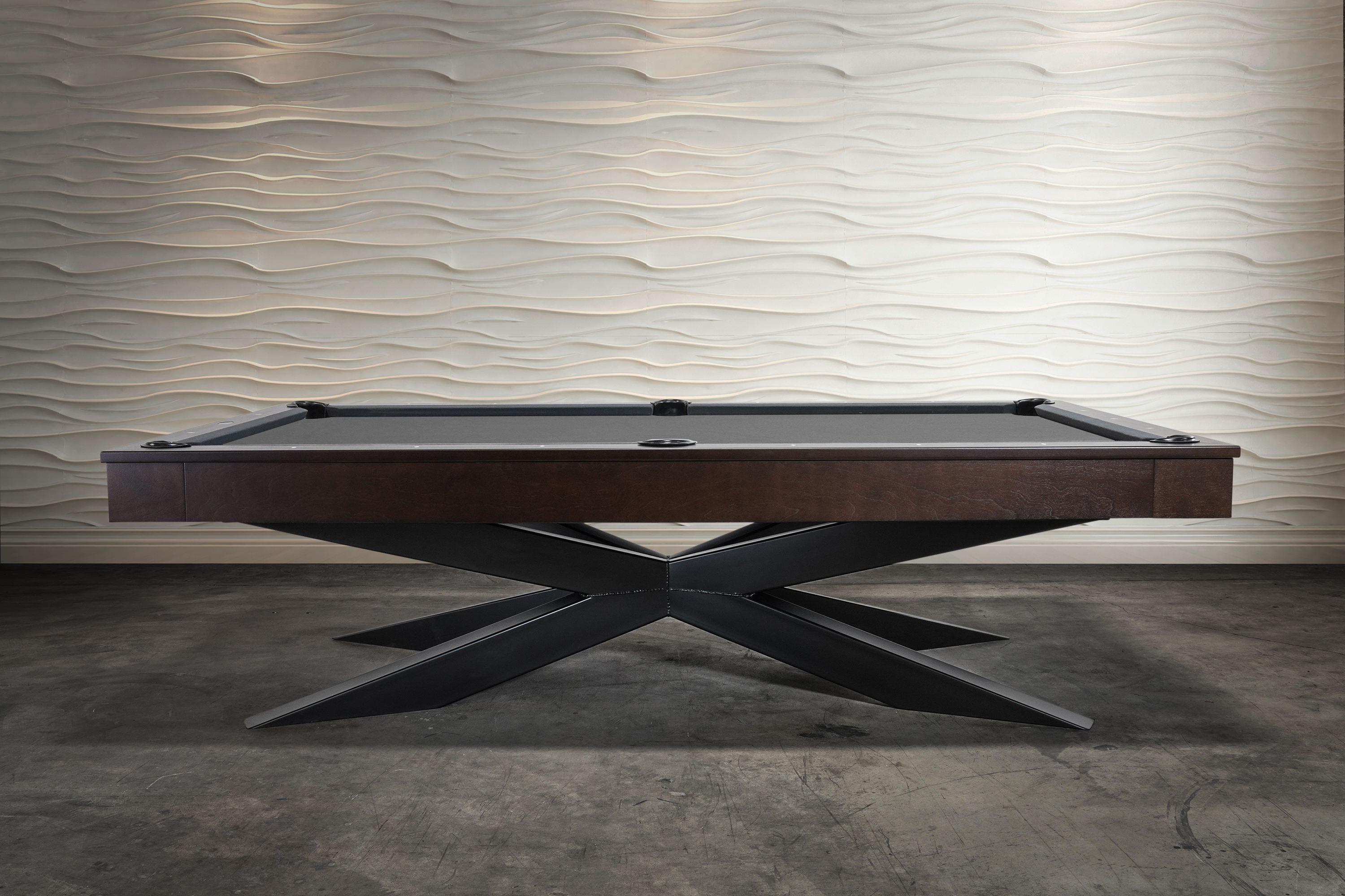 Full-length studio view of the Jett Slate Billiard Table by Doc & Holliday — handcrafted in the USA with a steel base and customizable hardwood frame. The design emphasizes architectural balance, pairing a professional three-piece slate playfield with refined furniture styling suited for luxury interiors.