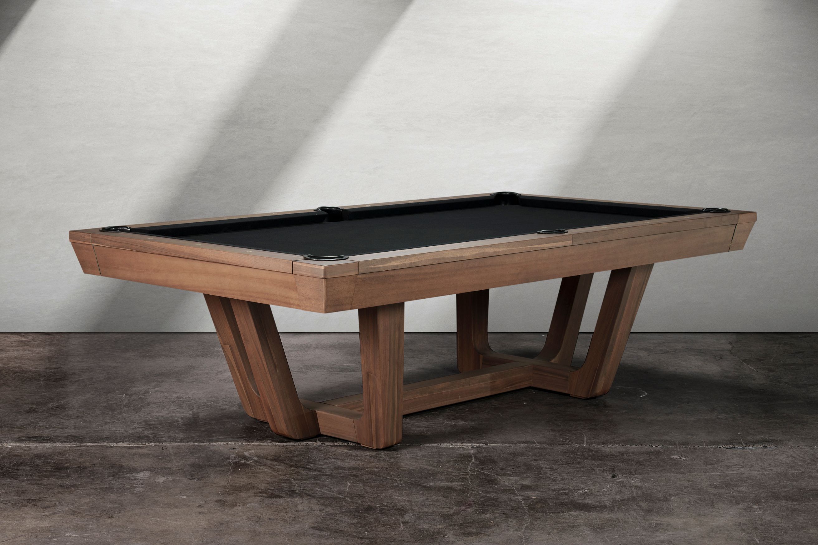 Gracy slate pool table by Doc & Holliday shown in walnut finish, transitional modern design with angular pedestal base