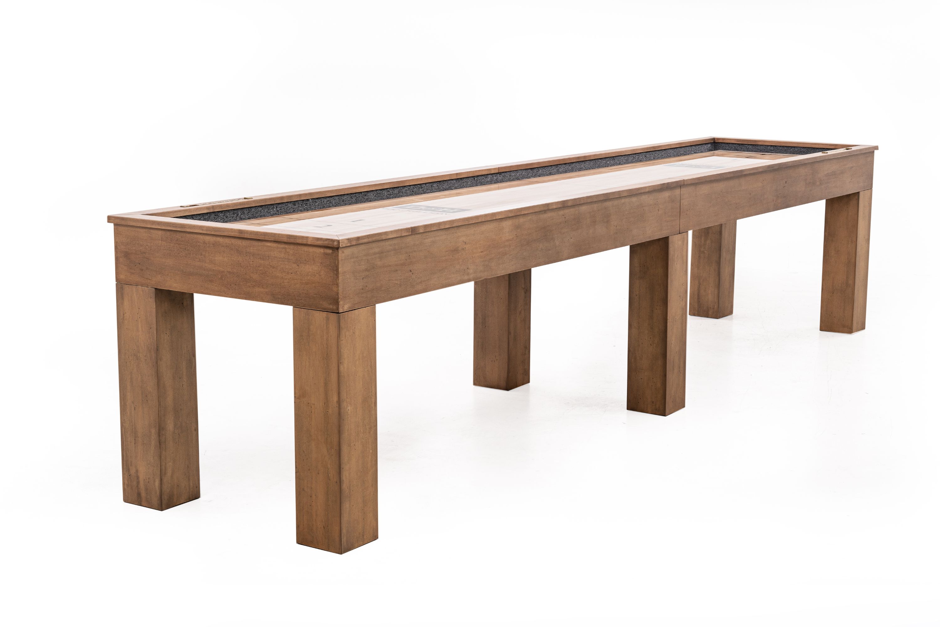 Three-quarter angle view of the Paula Parsons Shuffleboard Table in Glazed Maple finish by Doc & Holliday, photographed on a white background, highlighting Parsons-style legs and solid maple butcher block playfield.