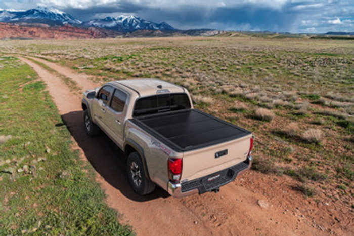 UnderCover Ultra Flex Hard Folding Truck Bed Tonneau Cover | Fits RAM 1500 DT w/RAMBOX