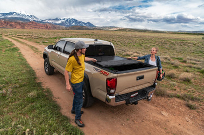 UnderCover Ultra Flex Hard Folding Truck Bed Tonneau Cover | Fits RAM 1500 DT w/RAMBOX