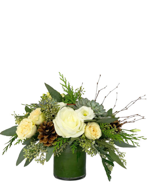 Woodland Elegance winter arrangement with white flowers, succulent, and pine cones in Albuquerque NM