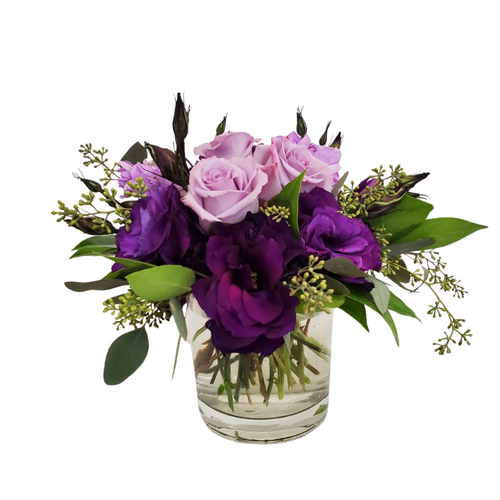 Purple Reign is a stylish arrangement with lavender roses, purple lisianthus, and eucalyptus. A graceful mix of soft purple tones perfect for any occasion. Purple Reign is a stylish arrangement with lavender roses, purple lisianthus, and eucalyptus. A graceful mix of soft purple tones perfect for any occasion.