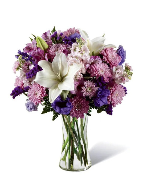Pretty in Purple is a fresh and charming bouquet featuring garden stock, Peruvian lilies, lisianthus, cushion mums, and purple statice. A vibrant mix of purple blooms. Pretty in Purple is a fresh and charming bouquet featuring garden stock, Peruvian lilies, lisianthus, cushion mums, and purple statice. A vibrant mix of purple blooms.