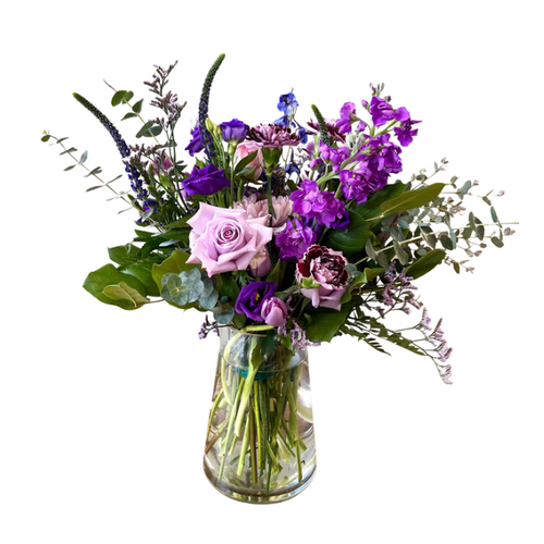 Shades of Purple is a lush floral arrangement with roses, garden stock, lisianthus, veronica, carnations, tulips, and eucalyptus in beautiful lavender and purple tones. Shades of Purple is a lush floral arrangement with roses, garden stock, lisianthus, veronica, carnations, tulips, and eucalyptus in beautiful lavender and purple tones.