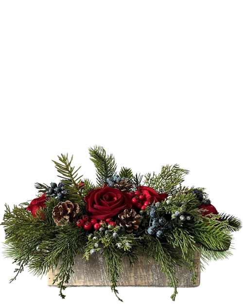 Red Forest Glow holiday centerpiece with red roses, berries, and pine cones in Albuquerque NM