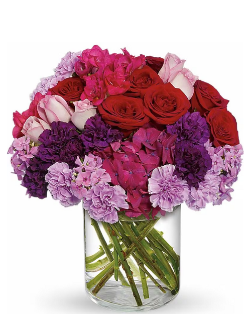 The Carnation Edit compact floral arrangement with roses, carnations, and hot pink hydrangea in a low modern glass vessel, Albuquerque florist