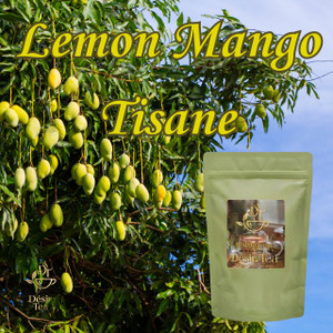 Desir Tea Lemon Mango Tisane in front of a leafy mango tree laden with ripening green mangoes.