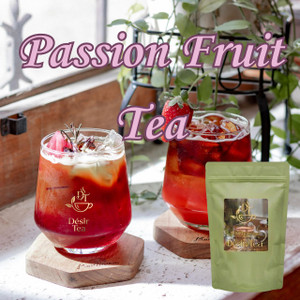 Desir Tea Passion Fruit Tea next to two iced red tea glasses garnished with fruit and herbs on wood coasters.